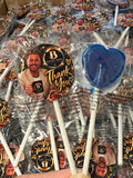 Blue raspberry heart-shaped lollies with personalised glossy stickers
